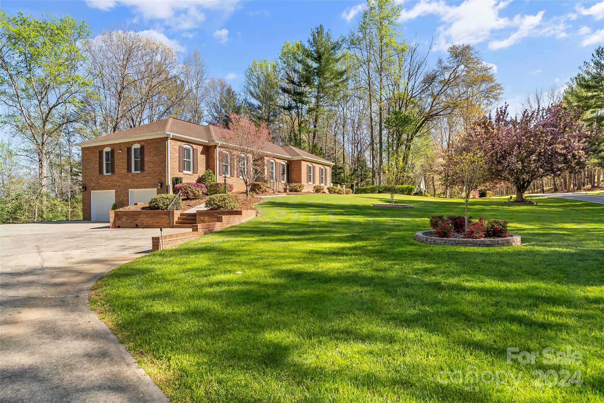 203 Lost Corner Road Morganton, NC 28655 - Photo 3 of 47 a front view of a house with a yard table and chairs