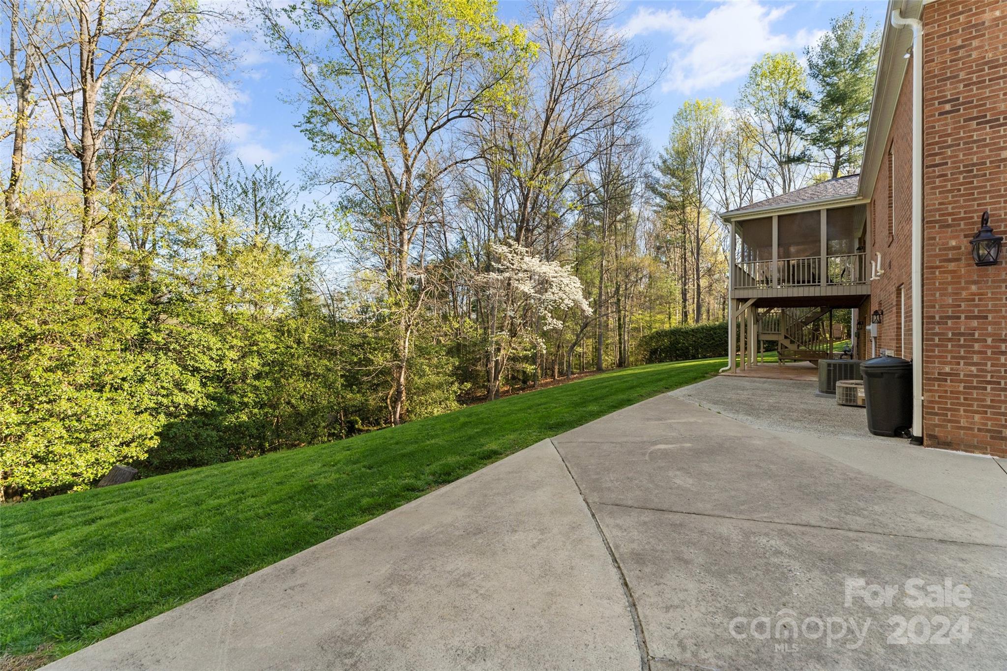 203 Lost Corner Road Morganton, NC 28655 - Photo 38 of 47 a view of a patio with table and chairs with wooden fence and plants