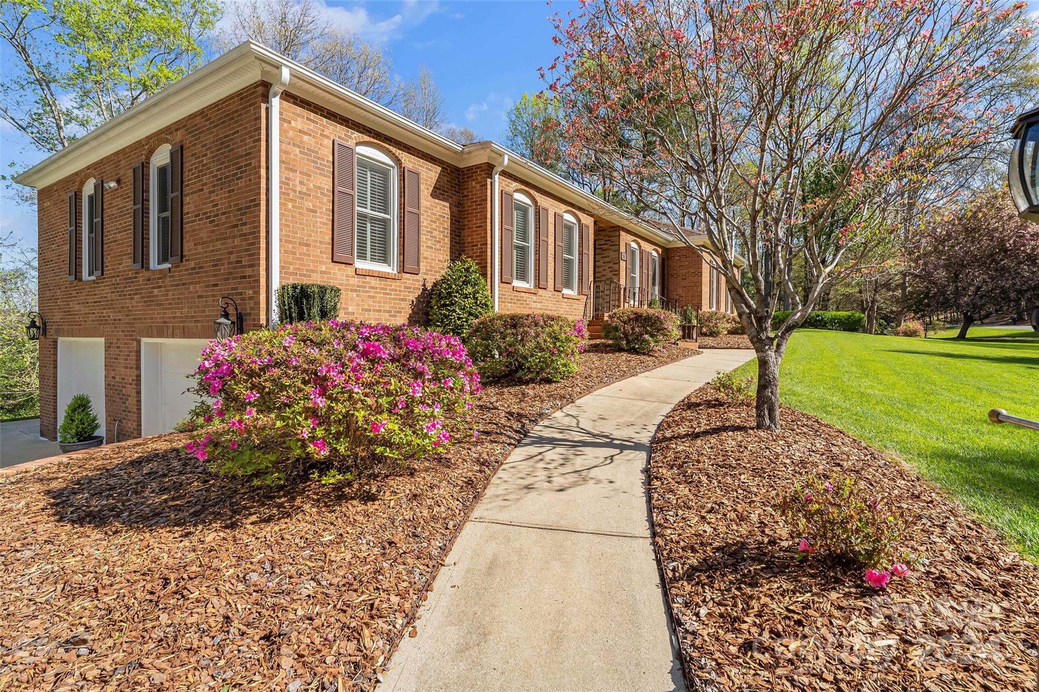 203 Lost Corner Road Morganton, NC 28655 - Photo 4 of 47 a front view of a house with garden