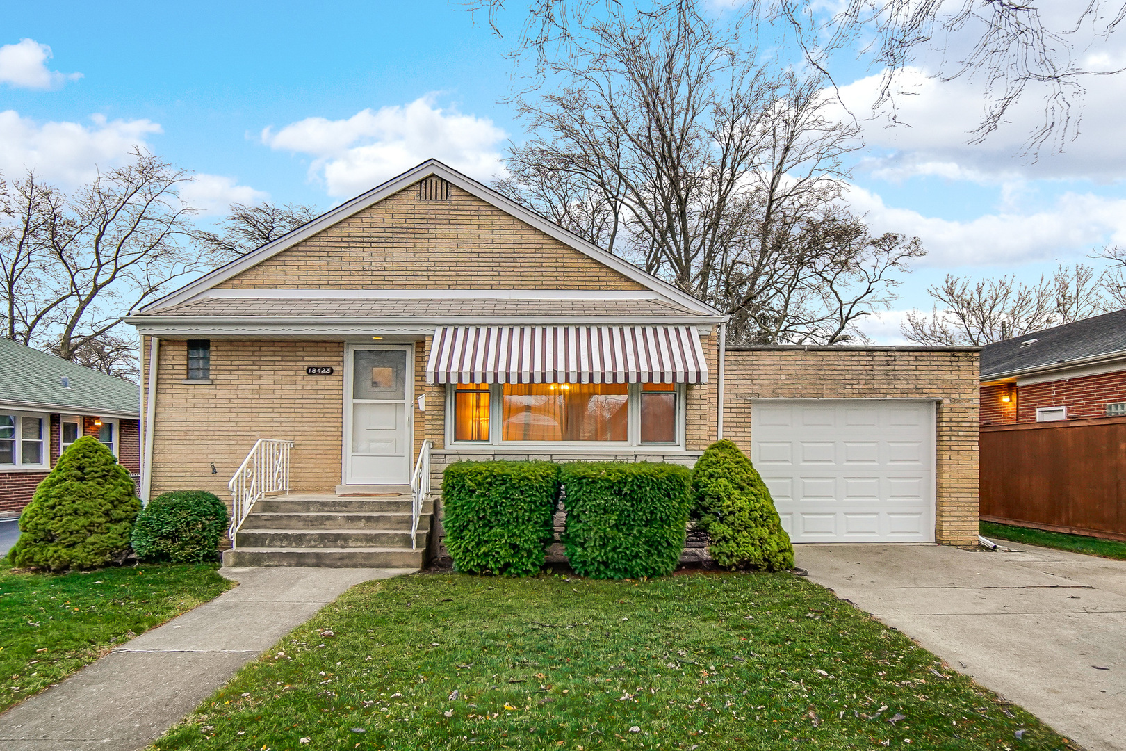 18423 Homewood Avenue Homewood, IL 60430 - Photo 1 of 27 a view of a house with a yard plants and large tree