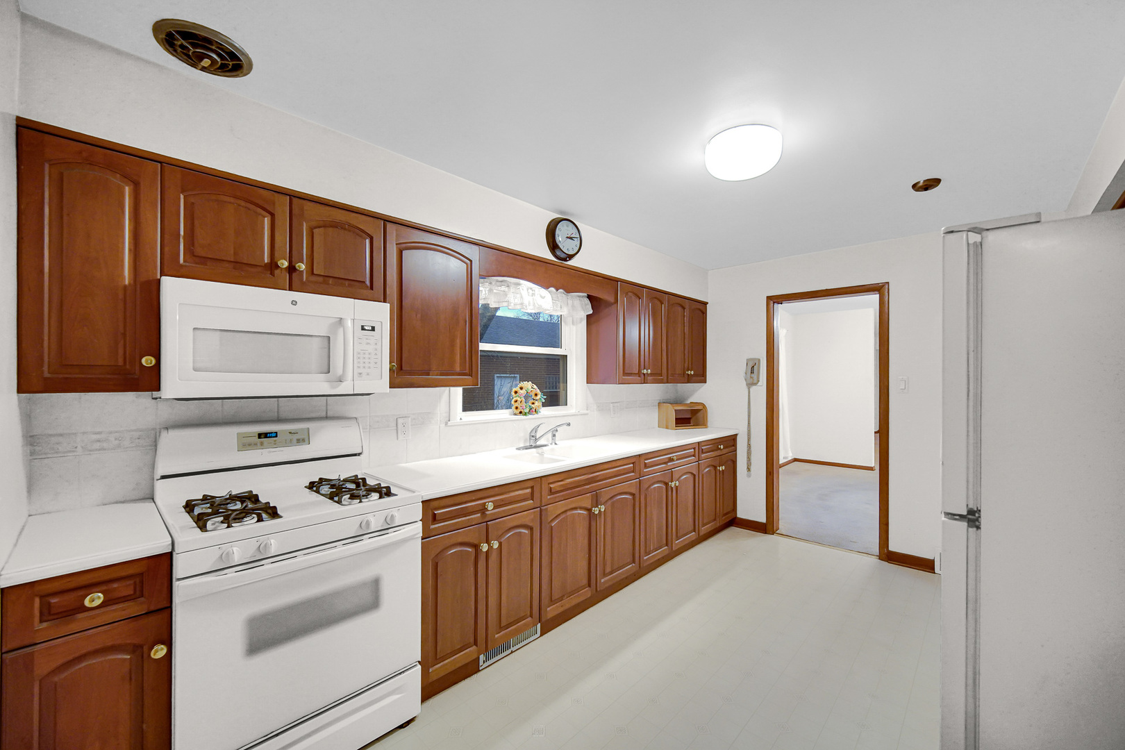 18423 Homewood Avenue Homewood, IL 60430 - Photo 4 of 27 a kitchen with stainless steel appliances granite countertop a stove and a sink