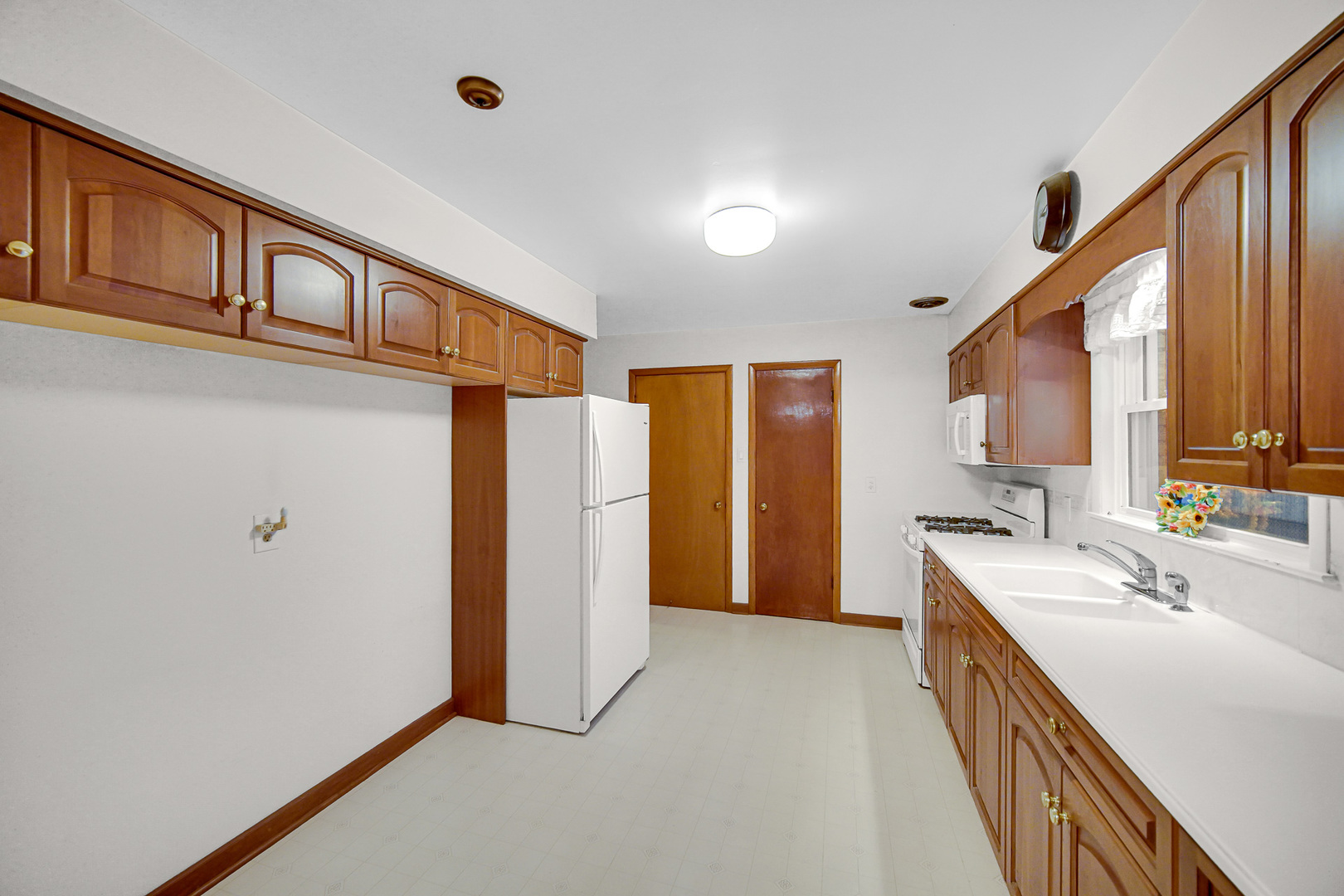18423 Homewood Avenue Homewood, IL 60430 - Photo 7 of 27 a bathroom with a double vanity sink and a mirror
