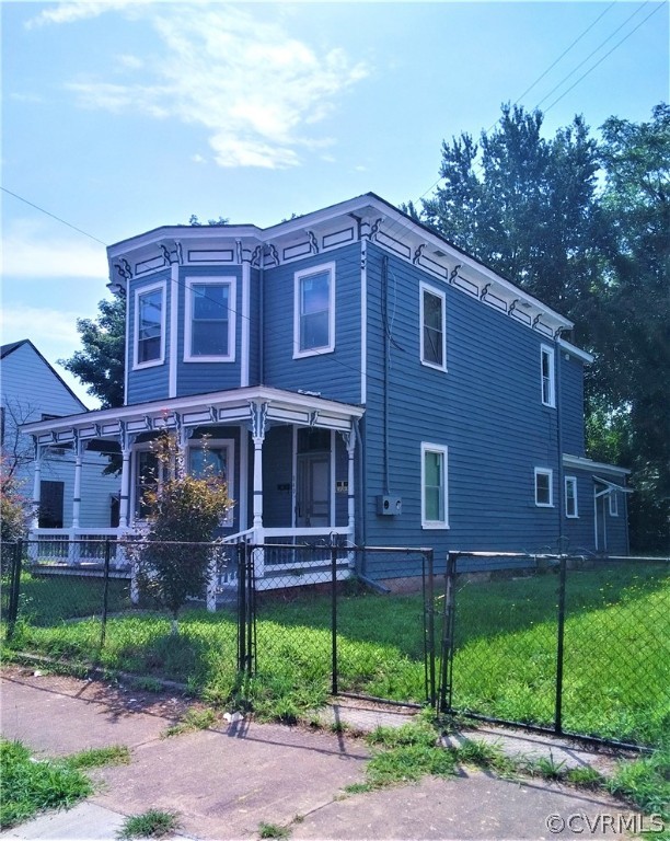 840 Commerce Street Petersburg, VA 23803 - Photo 2 of 38 a view of a brick building next to a yard