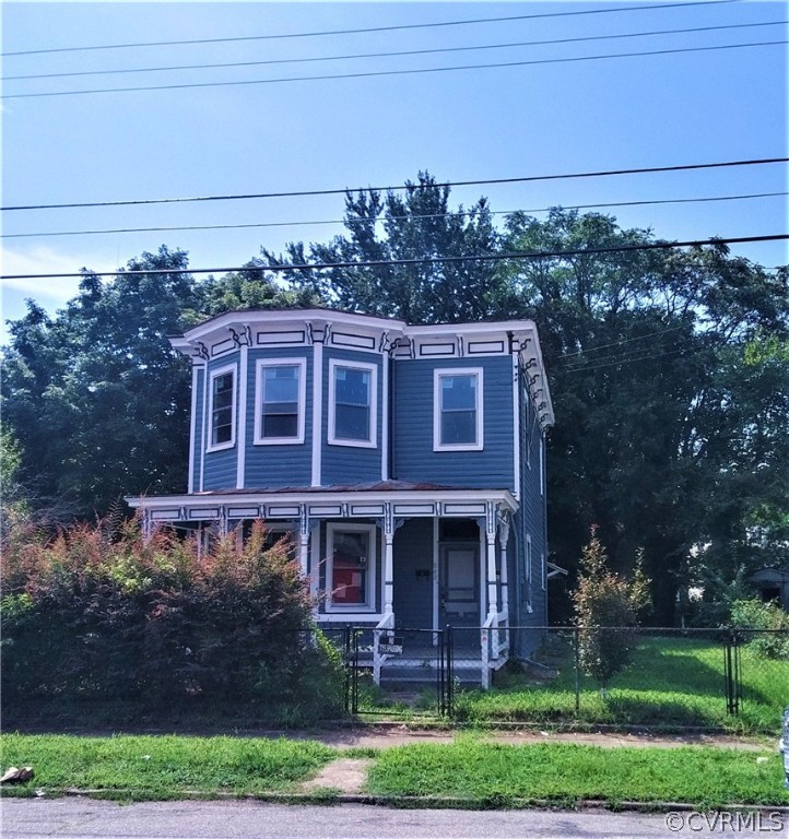 840 Commerce Street Petersburg, VA 23803 - Photo 8 of 38 a view of a brick house with a yard