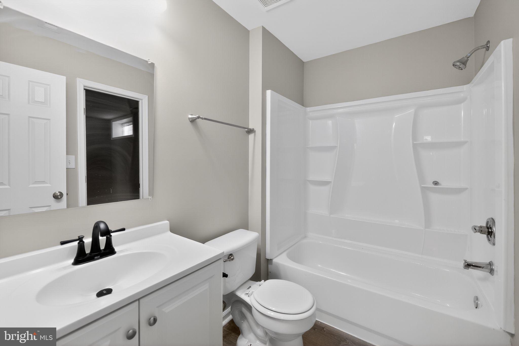 3524 Orchard Shade Road Randallstown, MD 21133 - Photo 15 of 34 a bathroom with a sink toilet and shower