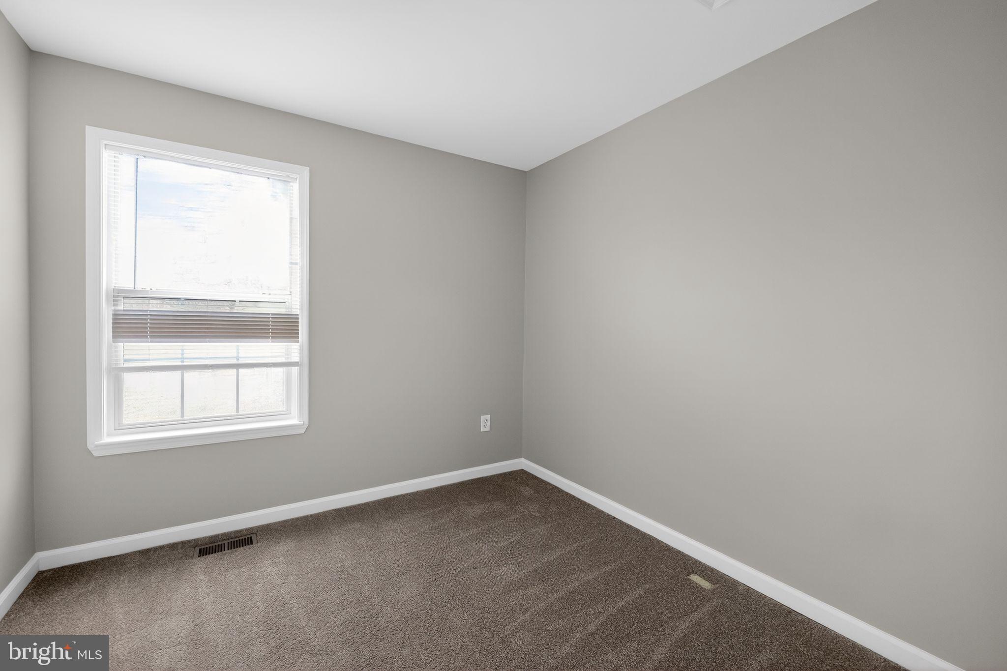 3524 Orchard Shade Road Randallstown, MD 21133 - Photo 21 of 34 an empty room with a window