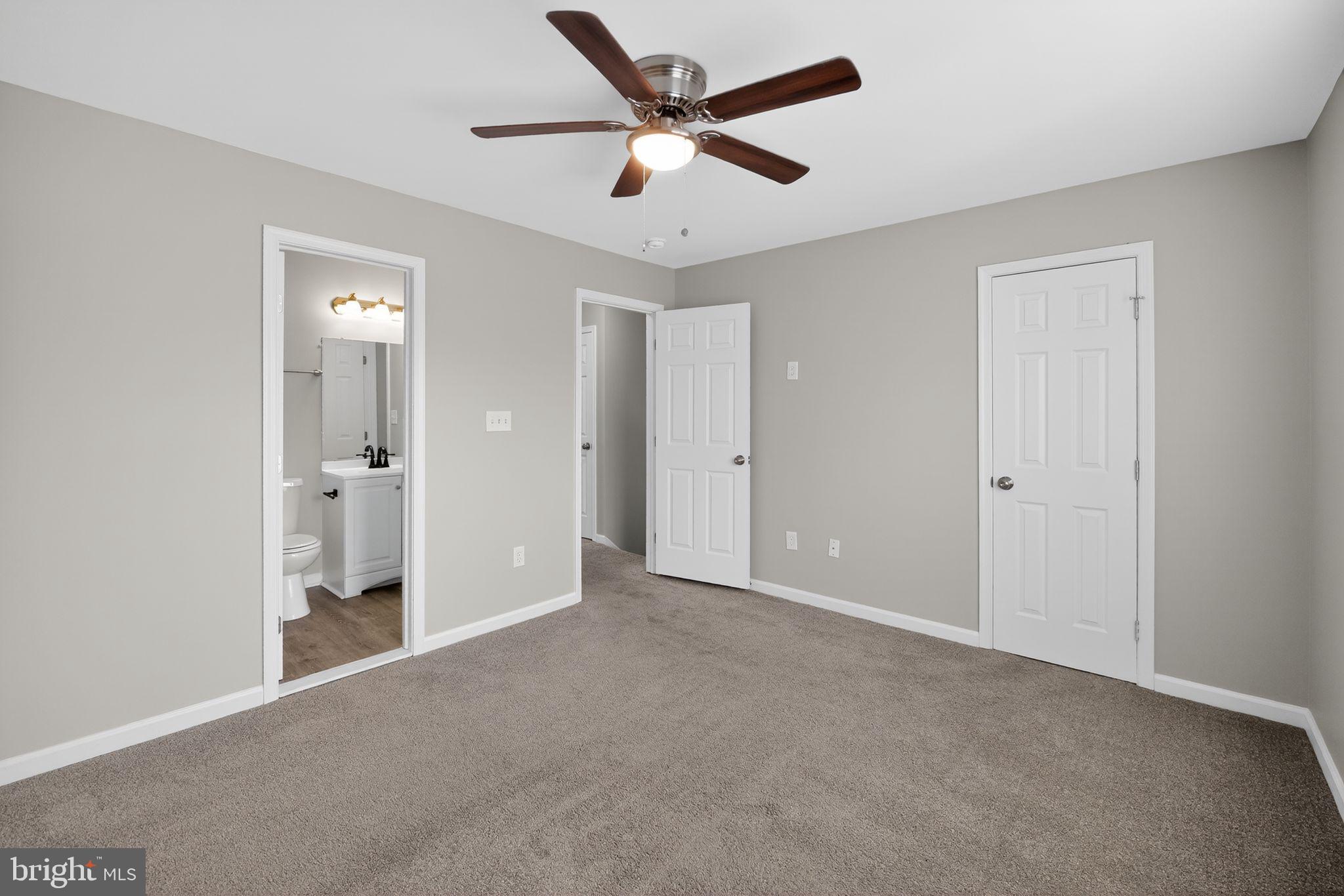 3524 Orchard Shade Road Randallstown, MD 21133 - Photo 26 of 34 a view of an empty room and a ceiling fan