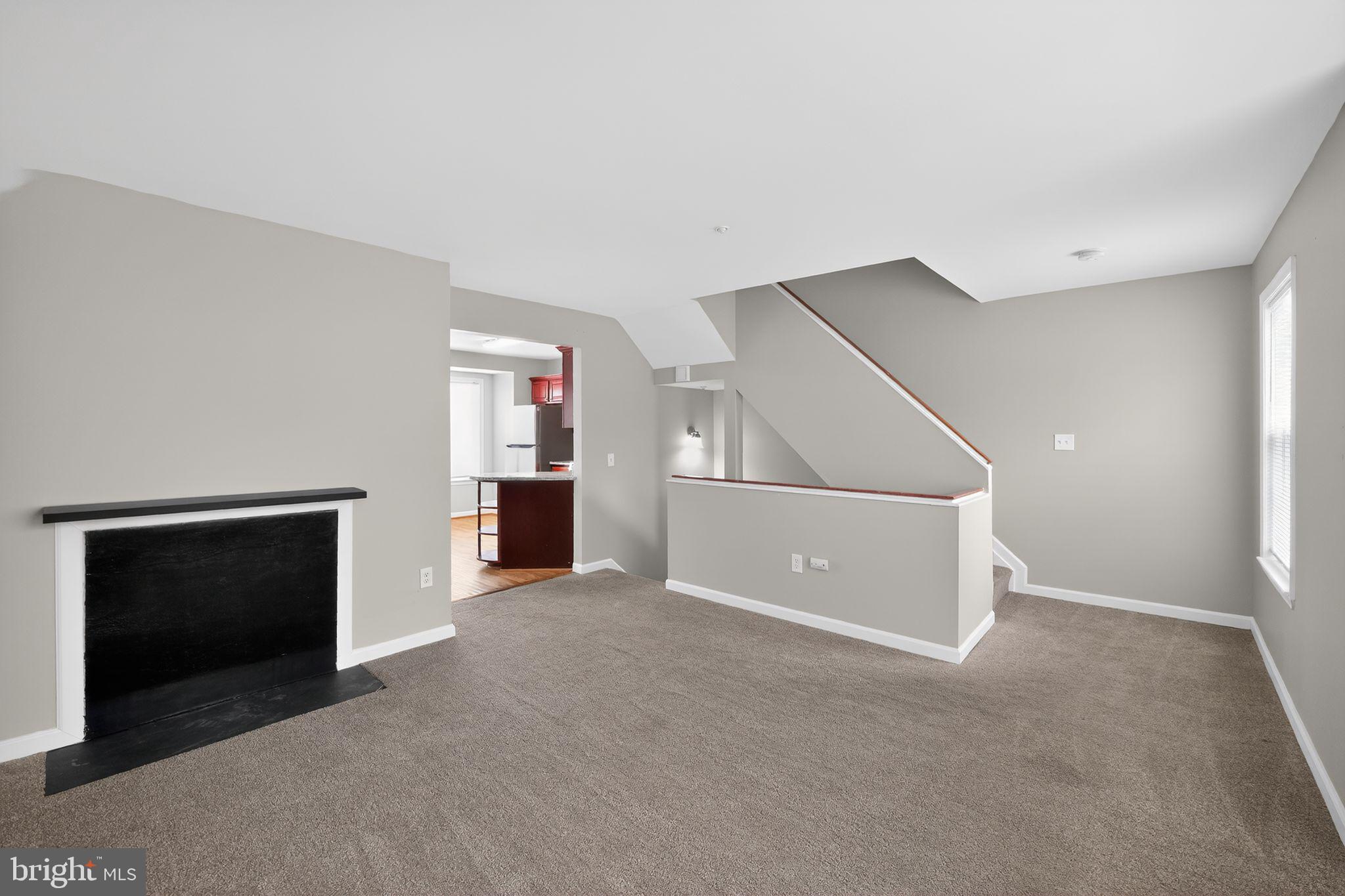 3524 Orchard Shade Road Randallstown, MD 21133 - Photo 3 of 34 a view of an empty room with closet and a fireplace