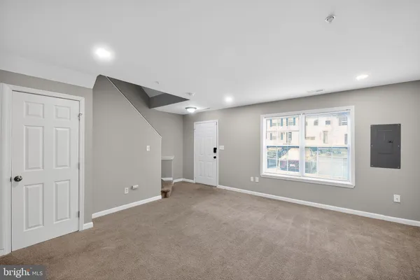 a view of an empty room with a window