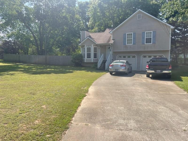 a view of a house with swimming pool in front of it