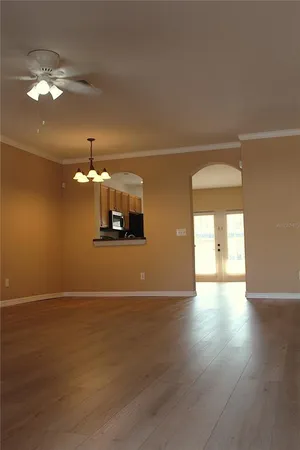 a view of a room with wooden floor