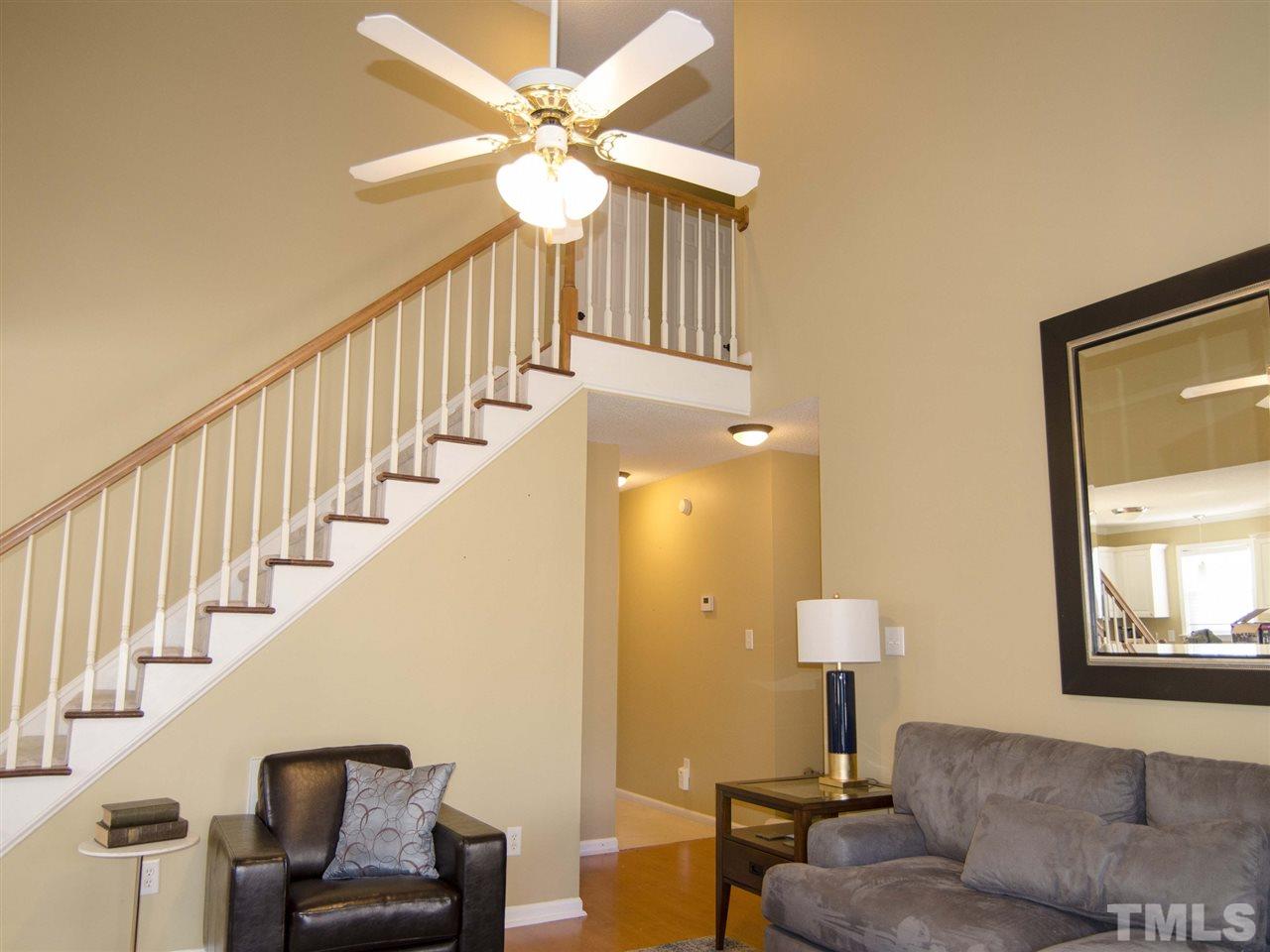 124 Fieldspring Lane Raleigh, NC 27606 - Photo 2 of 24 a living room with furniture and a lamp