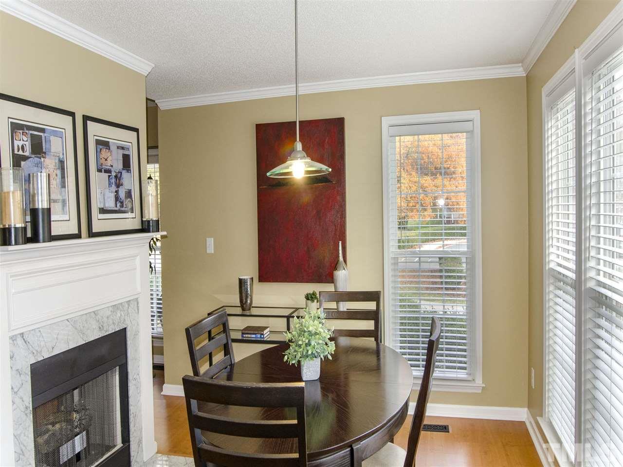 124 Fieldspring Lane Raleigh, NC 27606 - Photo 11 of 24 a dining room with furniture and window