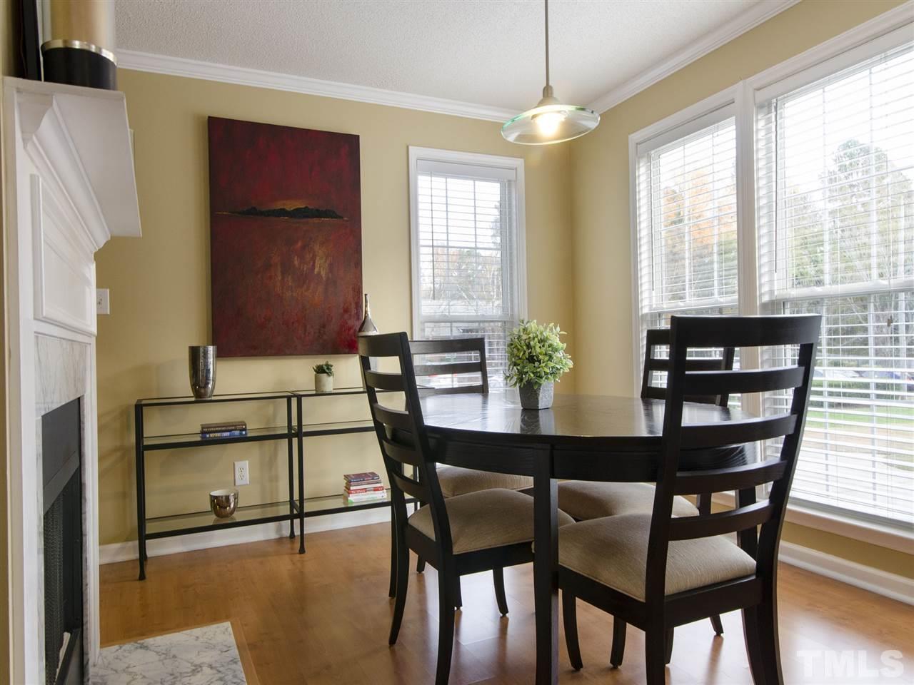 124 Fieldspring Lane Raleigh, NC 27606 - Photo 12 of 24 a dining room with furniture and window
