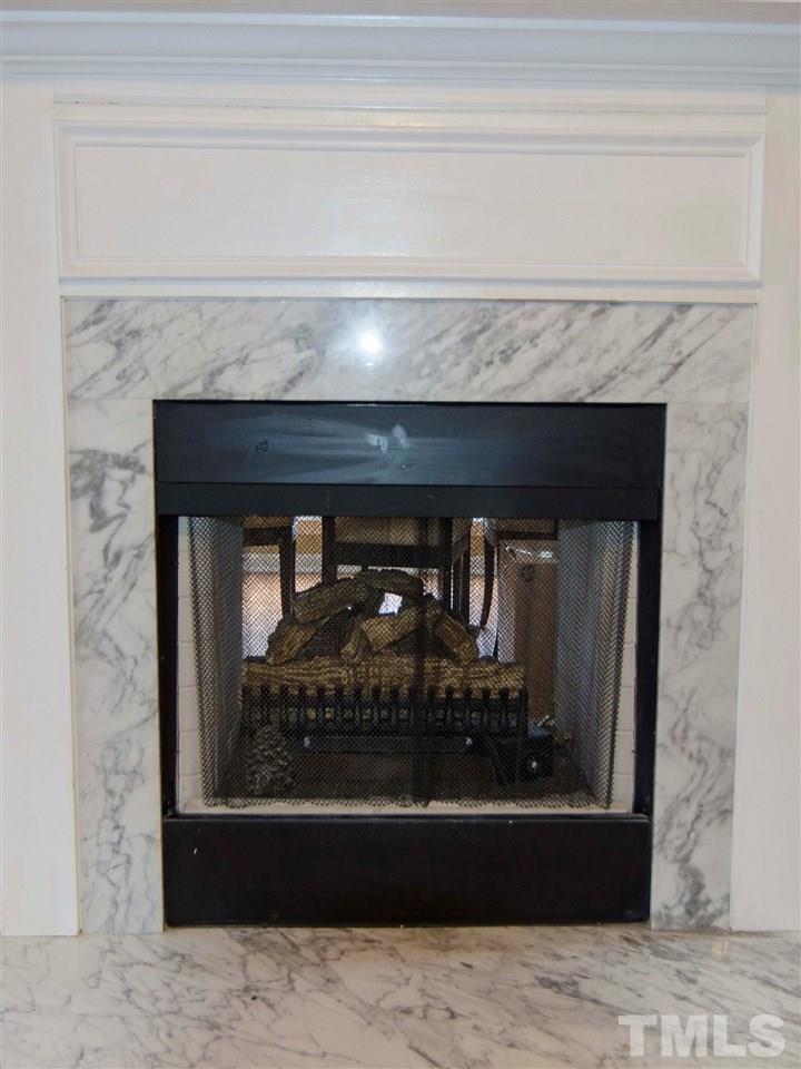 124 Fieldspring Lane Raleigh, NC 27606 - Photo 13 of 24 a view of a living room that has a fireplace
