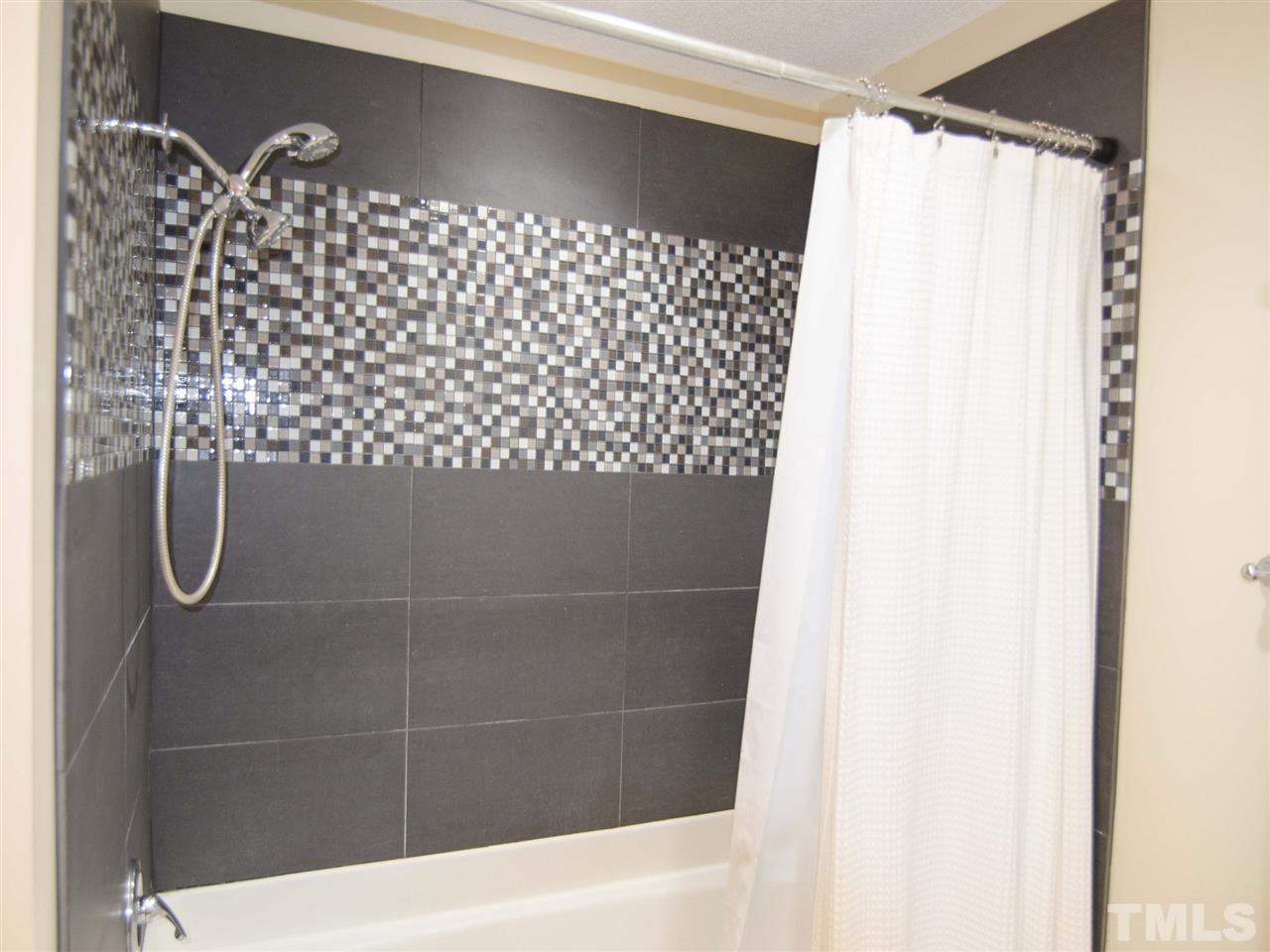 124 Fieldspring Lane Raleigh, NC 27606 - Photo 16 of 24 a bathroom with a shower