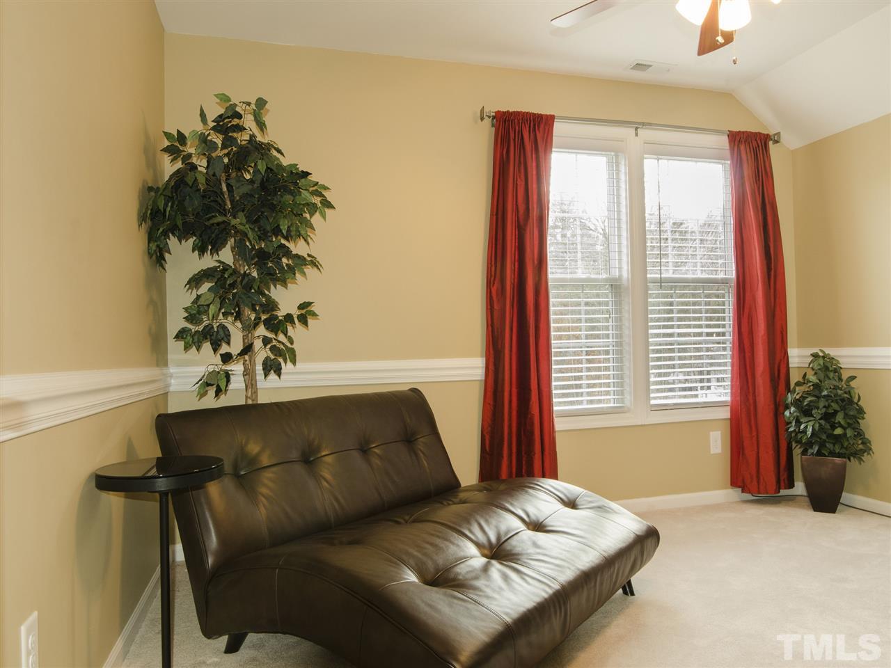 124 Fieldspring Lane Raleigh, NC 27606 - Photo 20 of 24 a living room with furniture and a window