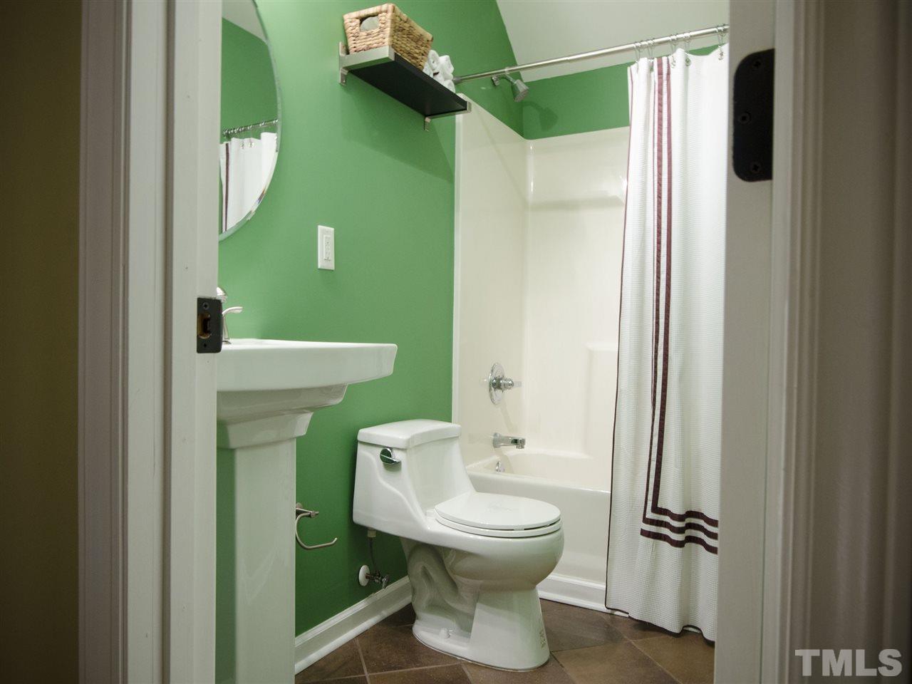 124 Fieldspring Lane Raleigh, NC 27606 - Photo 22 of 24 a bathroom with a sink and toilet