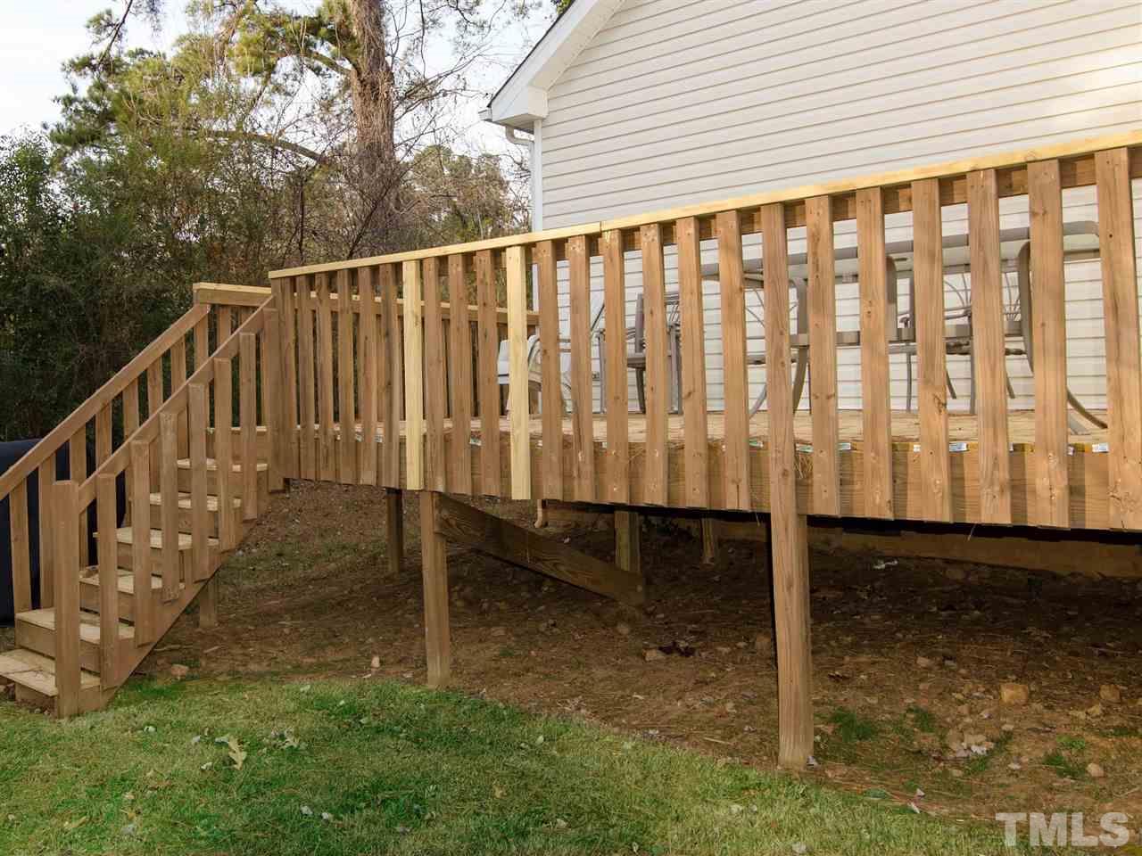 124 Fieldspring Lane Raleigh, NC 27606 - Photo 24 of 24 a porch with a bench