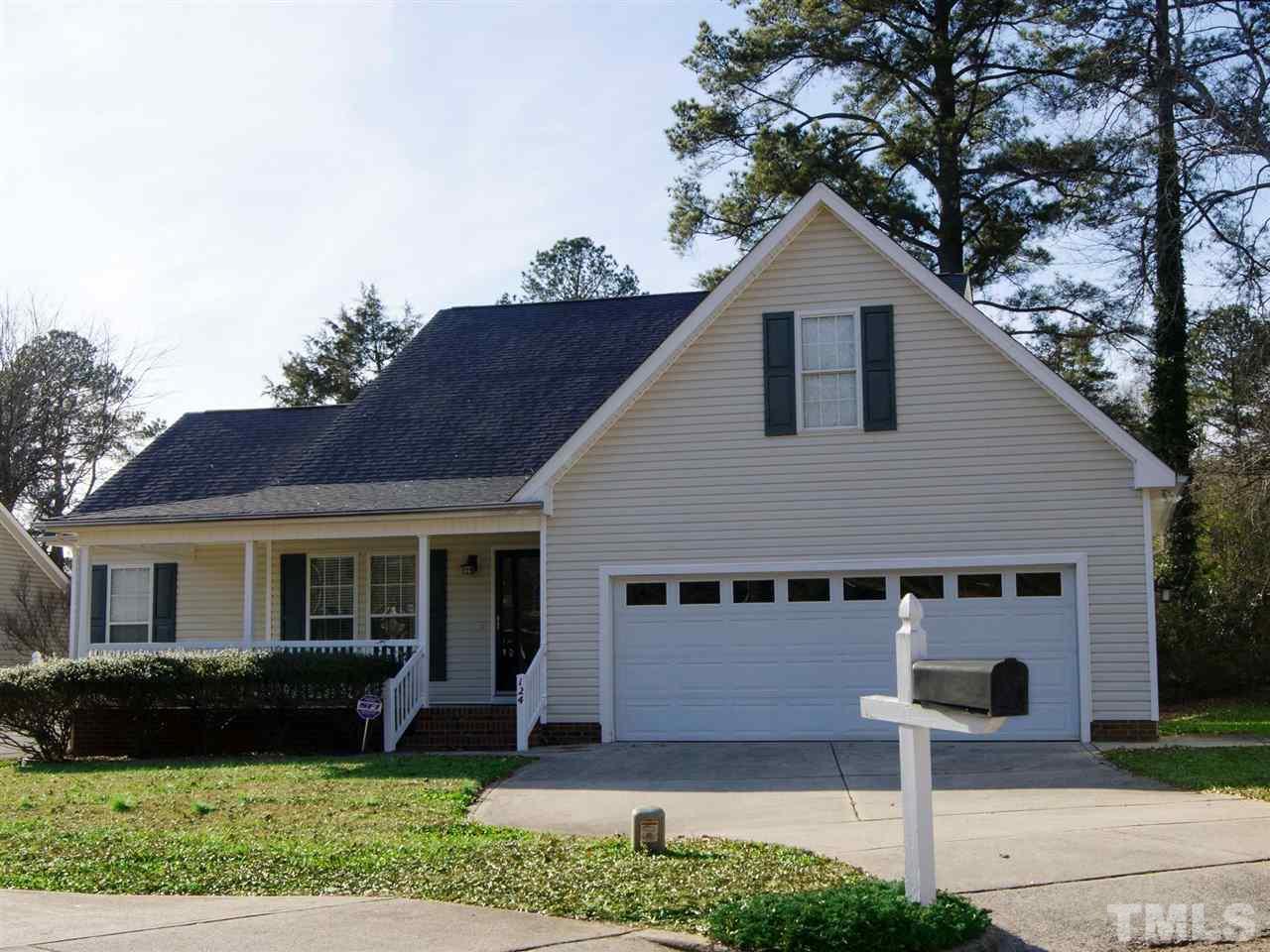 124 Fieldspring Lane Raleigh, NC 27606 - Photo 4 of 24 a front view of a house with a yard
