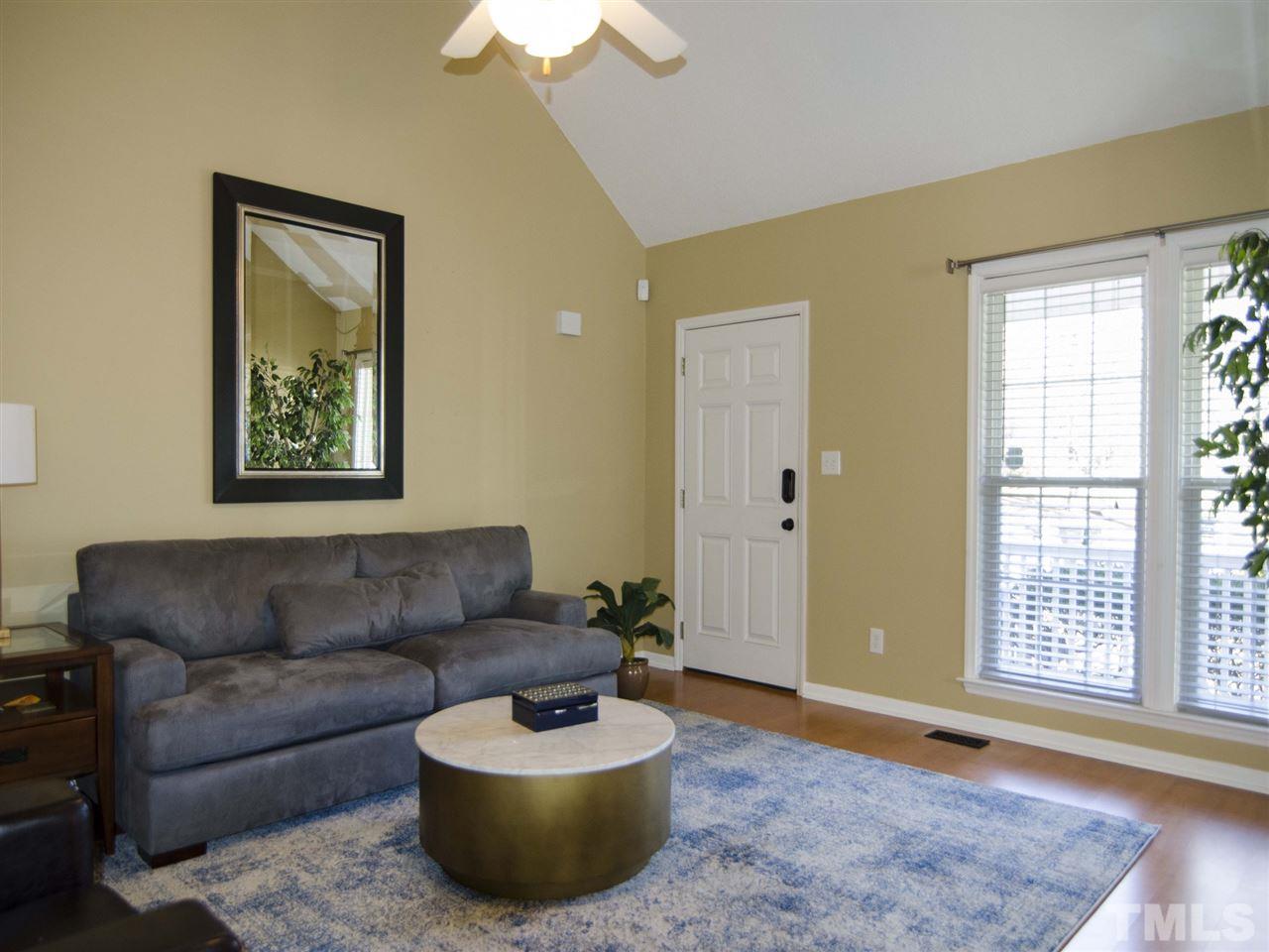 124 Fieldspring Lane Raleigh, NC 27606 - Photo 6 of 24 a living room with furniture and a window
