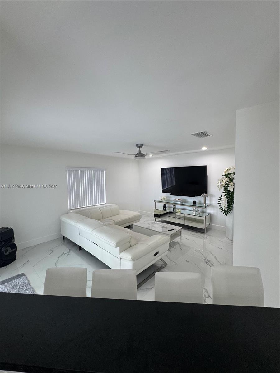 11111 Southwest 147th Court Miami, FL 33196 - Photo 14 of 42 a bedroom with furniture and flat screen tv