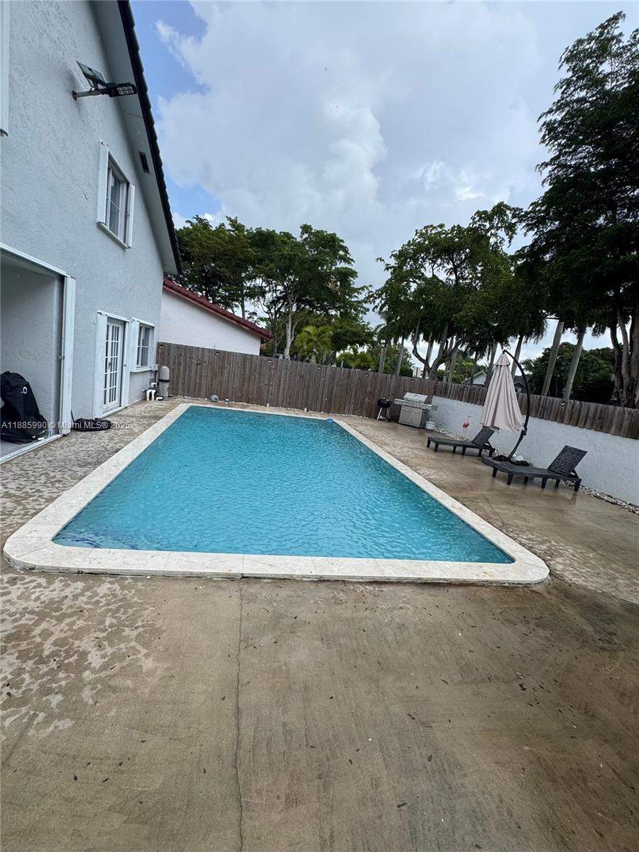 11111 Southwest 147th Court Miami, FL 33196 - Photo 18 of 42 a view of a mini theater with a slide