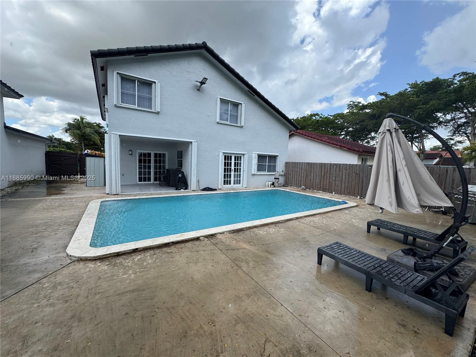11111 Southwest 147th Court Miami, FL 33196 - Photo 20 of 42 a view of a backyard with a patio