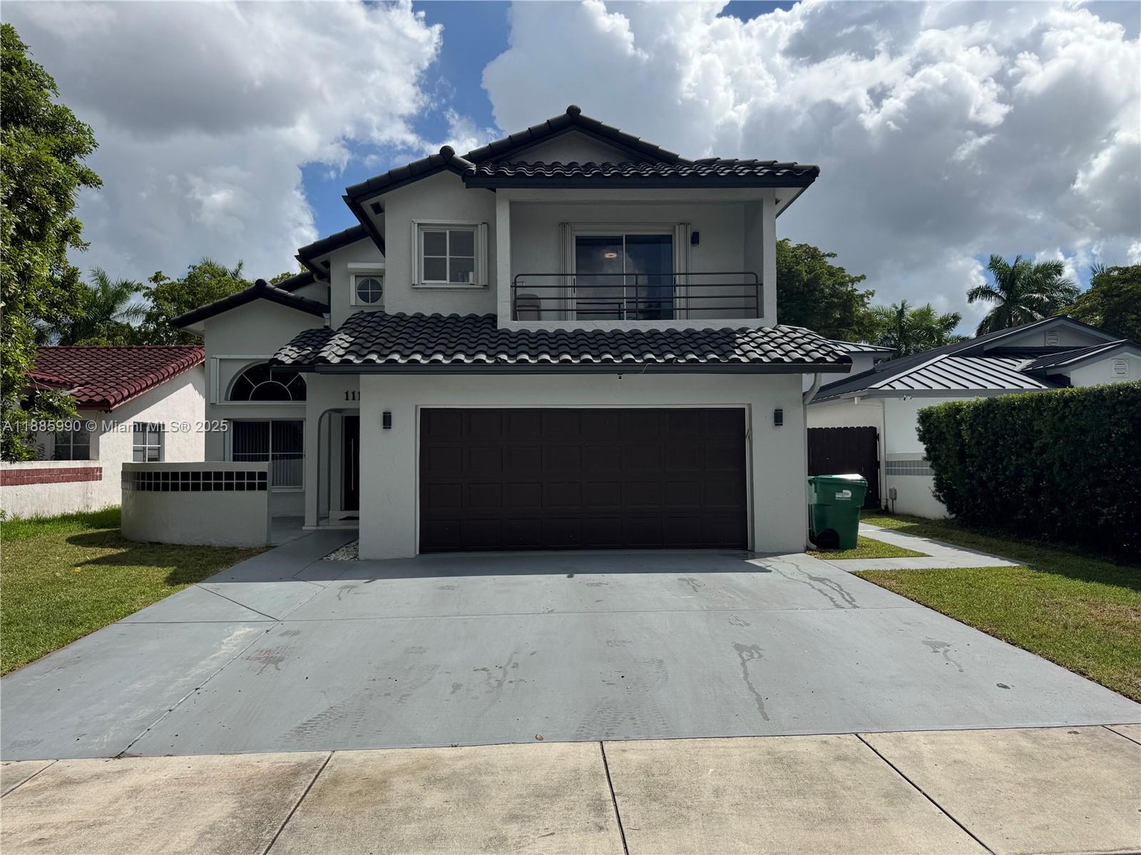 11111 Southwest 147th Court Miami, FL 33196 - Photo 3 of 42 a front view of a house with a yard