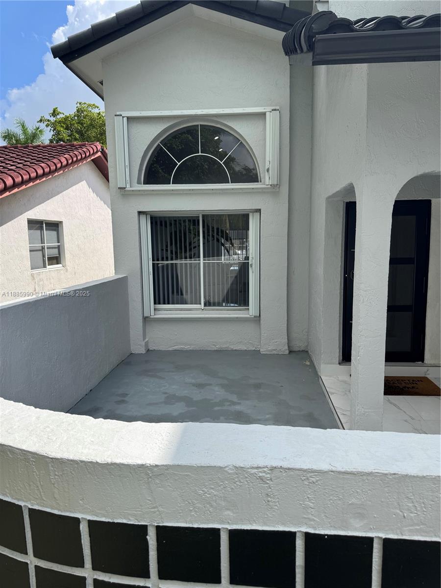 11111 Southwest 147th Court Miami, FL 33196 - Photo 5 of 42 a front view of a house with garage