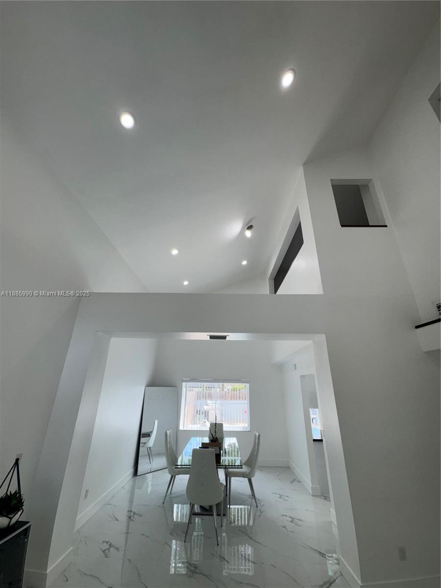 11111 Southwest 147th Court Miami, FL 33196 - Photo 9 of 42 a view of a room with furniture and wooden floor