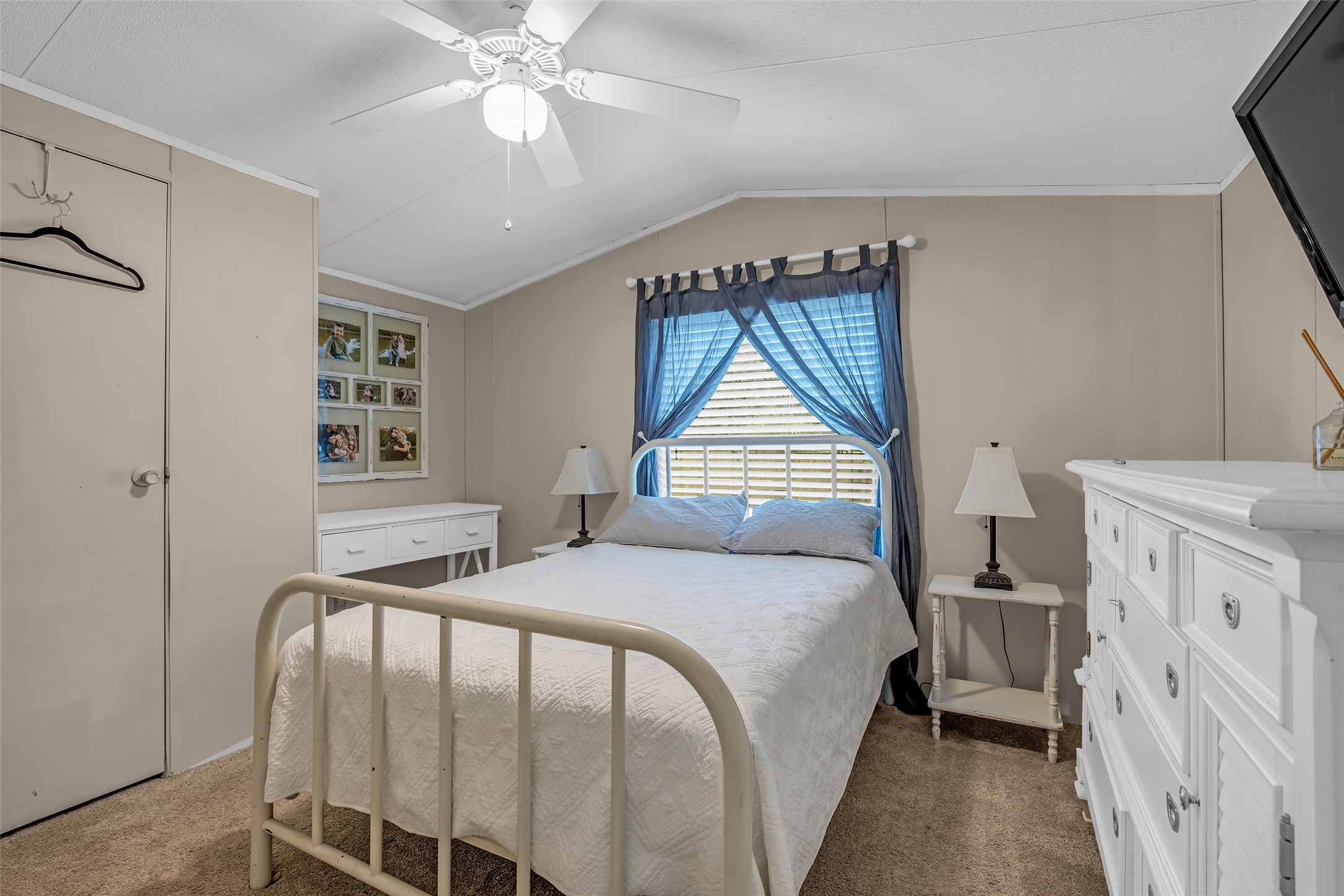 188 Chrissy Lane Trinity, TX 75862 - Photo 12 of 25 a bedroom with a bed and a chandelier