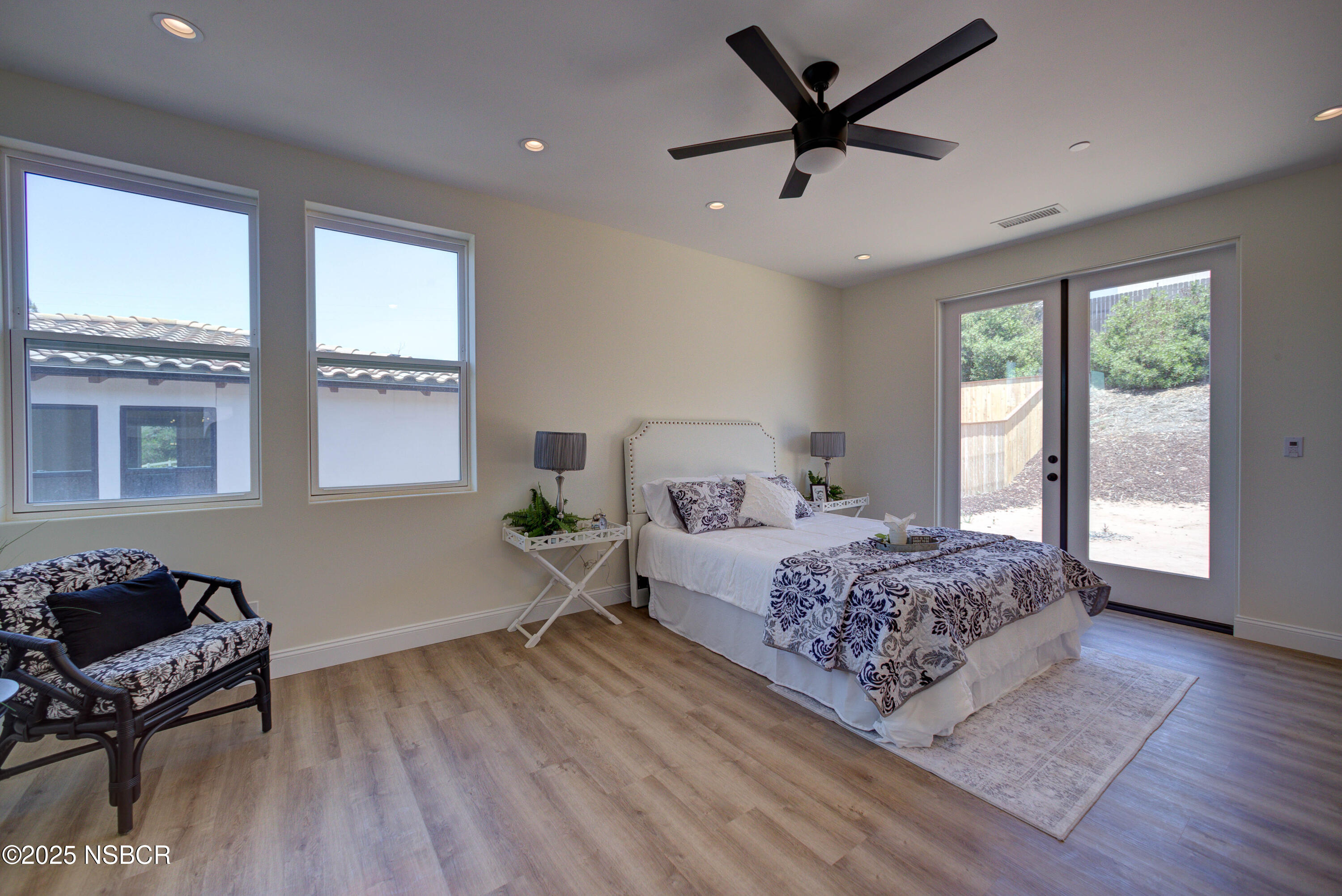 1607 Tuscan Way Santa Maria, CA 93455 - Photo 17 of 37 a bedroom with a bed and wooden floor