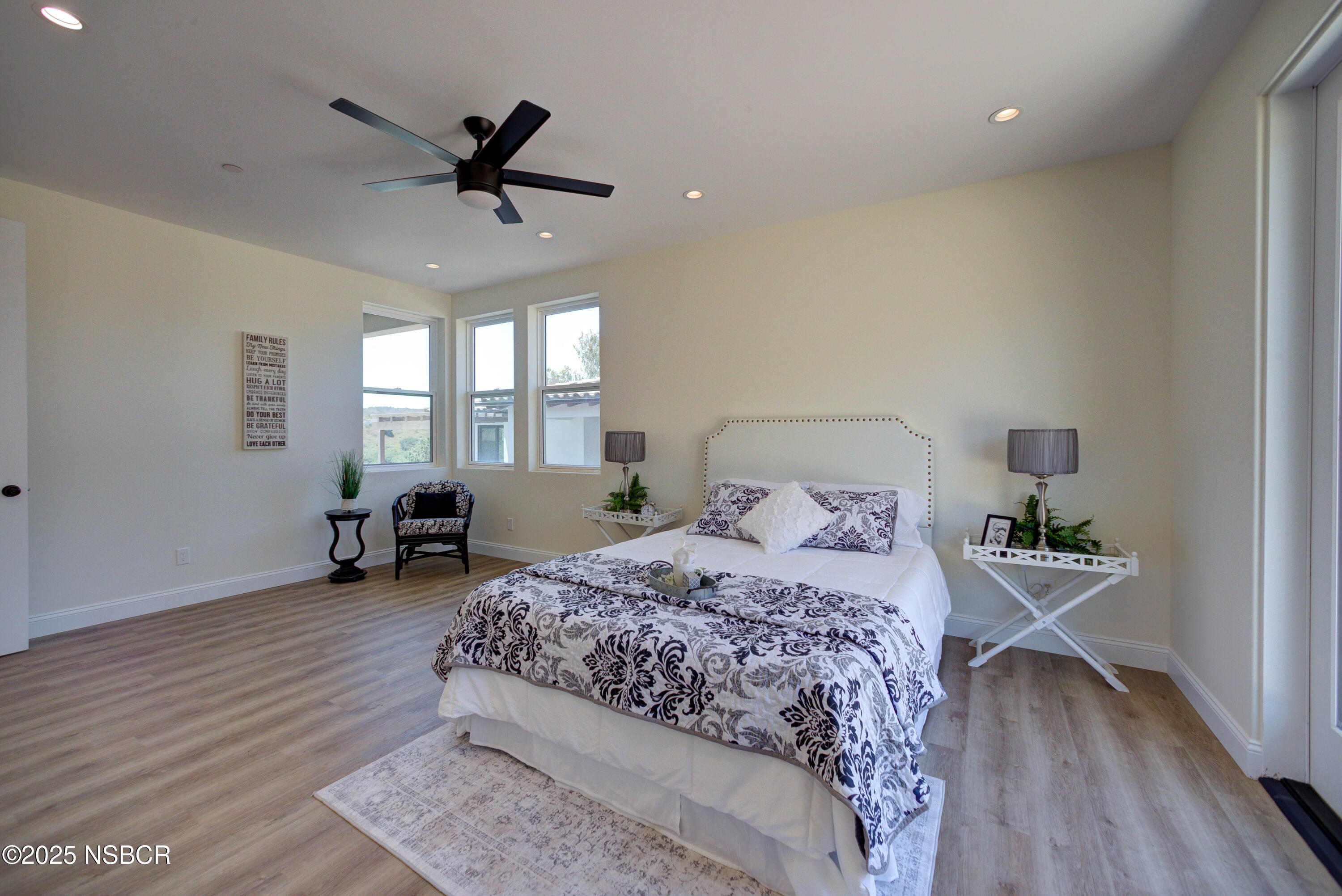 1607 Tuscan Way Santa Maria, CA 93455 - Photo 18 of 37 a bedroom with a bed and a chandelier