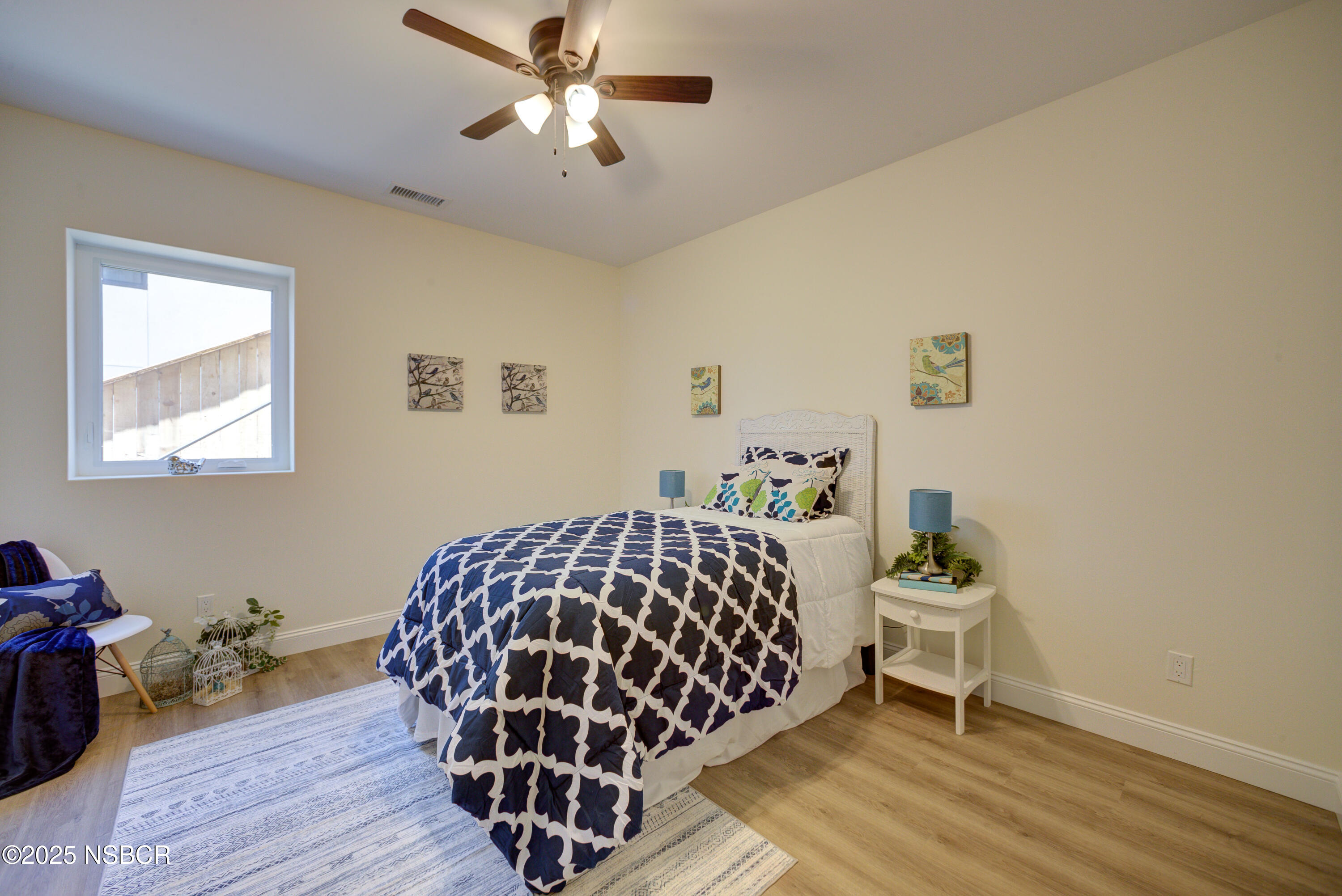 1607 Tuscan Way Santa Maria, CA 93455 - Photo 24 of 37 a bedroom with a bed and a table in it