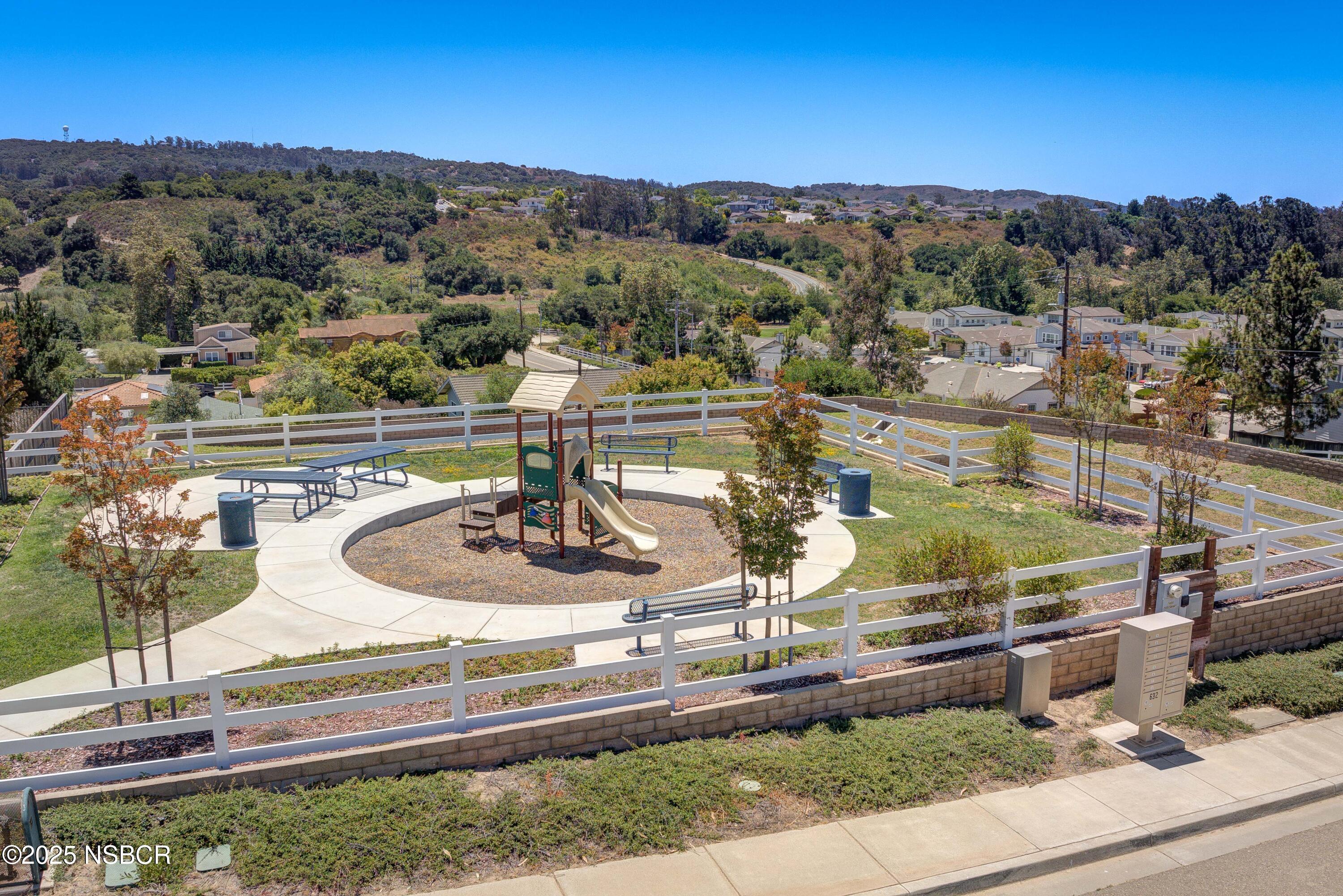 1607 Tuscan Way Santa Maria, CA 93455 - Photo 36 of 37 a view of a swimming pool with a lake view