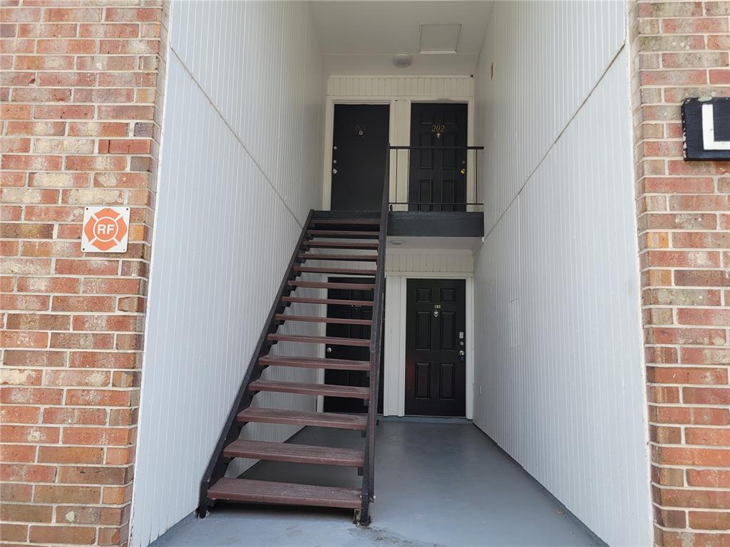 5317 Curry Ford Road, Unit 20 Orlando, FL 32812 - Photo 2 of 18 a view of an entryway with stairs