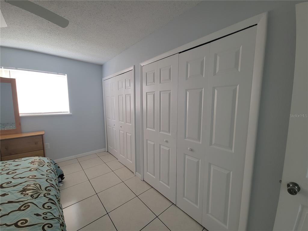 5317 Curry Ford Road, Unit 20 Orlando, FL 32812 - Photo 7 of 18 a bedroom with a bed and a window