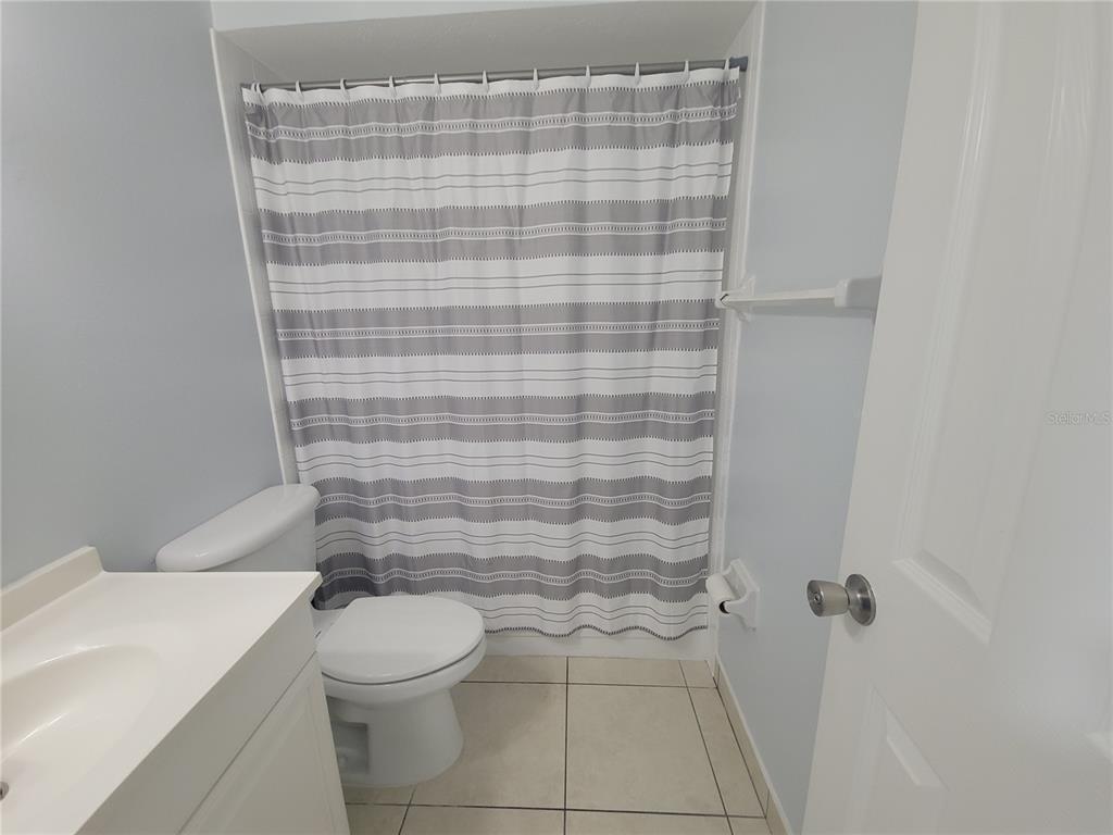 5317 Curry Ford Road, Unit 20 Orlando, FL 32812 - Photo 8 of 18 a bathroom with a toilet and a shower