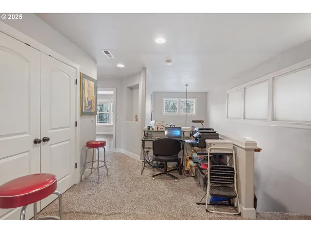 a workspace with furniture and a bathroom