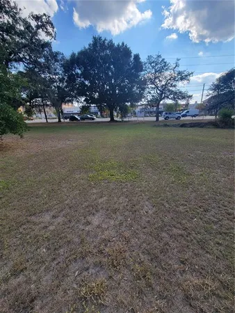 a view of a yard with a tree
