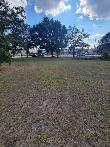 a view of a yard with a tree