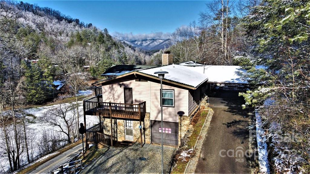 789 Tobacco Branch Road Almond, NC 28702 - Photo 2 of 42 a view of a house with backyard and sitting area