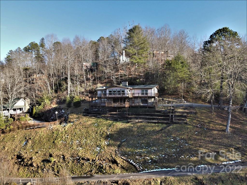 789 Tobacco Branch Road Almond, NC 28702 - Photo 3 of 42 a view of a yard with wooden fence