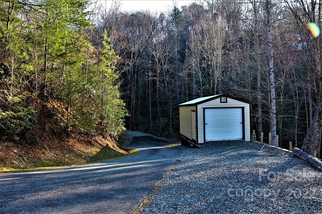789 Tobacco Branch Road Almond, NC 28702 - Photo 31 of 42 a front view of a house with a yard