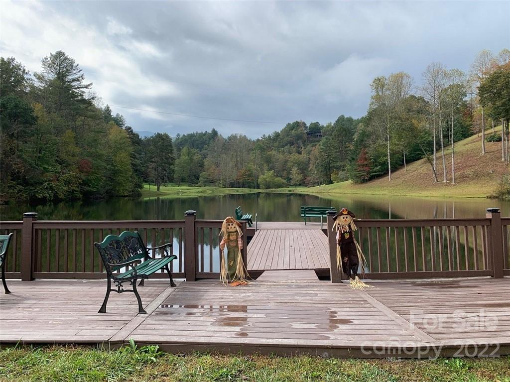 789 Tobacco Branch Road Almond, NC 28702 - Photo 35 of 42 a view of a table and chairs on the deck