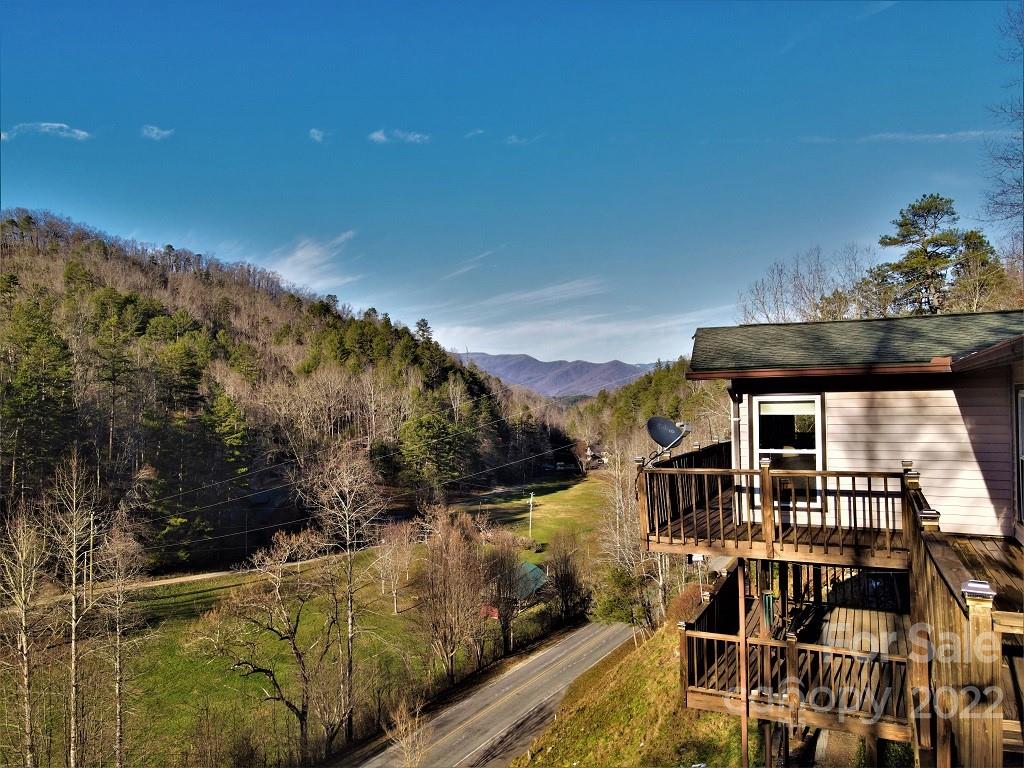 789 Tobacco Branch Road Almond, NC 28702 - Photo 4 of 42 a view of a house with a yard from a balcony