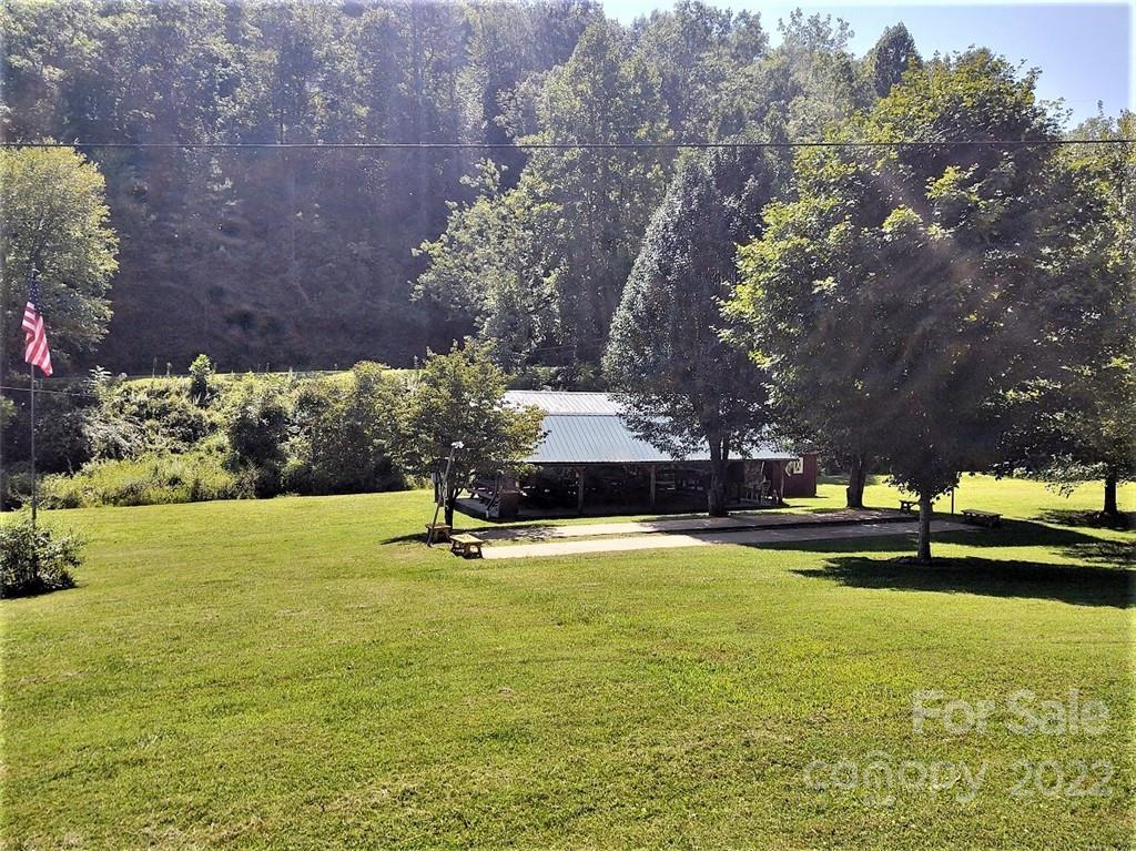 789 Tobacco Branch Road Almond, NC 28702 - Photo 41 of 42 a view of a swimming pool and trees in the background