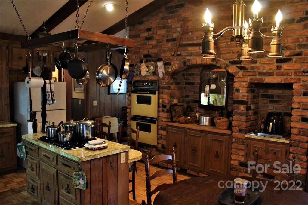 789 Tobacco Branch Road Almond, NC 28702 - Photo 8 of 42 a view of a chairs and table in a room