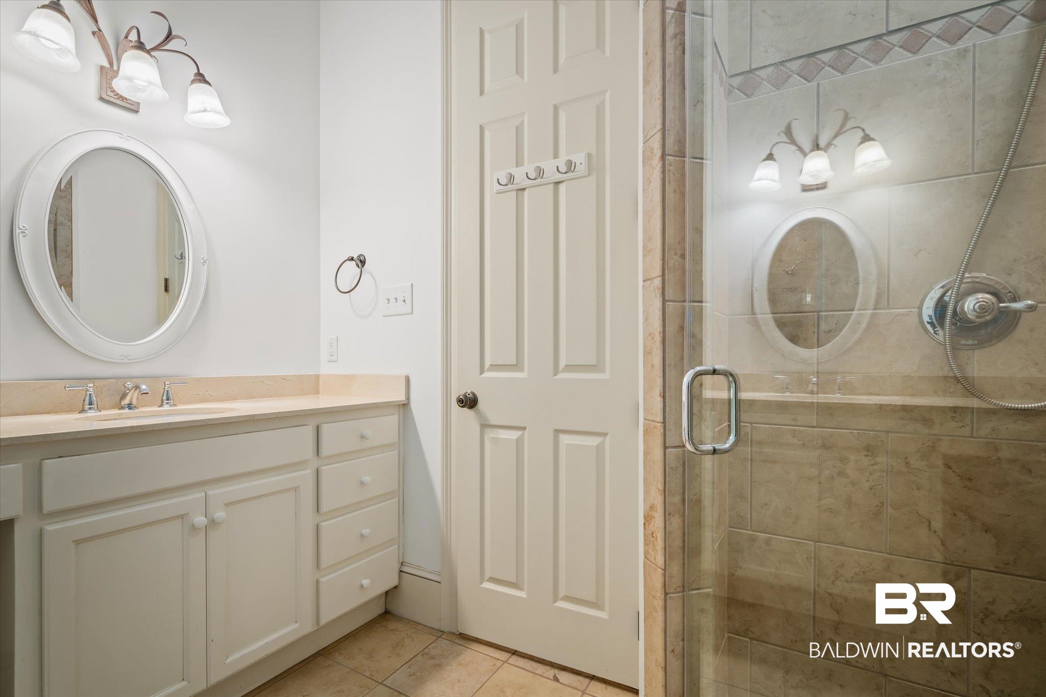 812 Country Club Court Mobile, AL 36609 - Photo 16 of 34 Bathroom featuring vanity, tile patterned flooring, and a shower with door